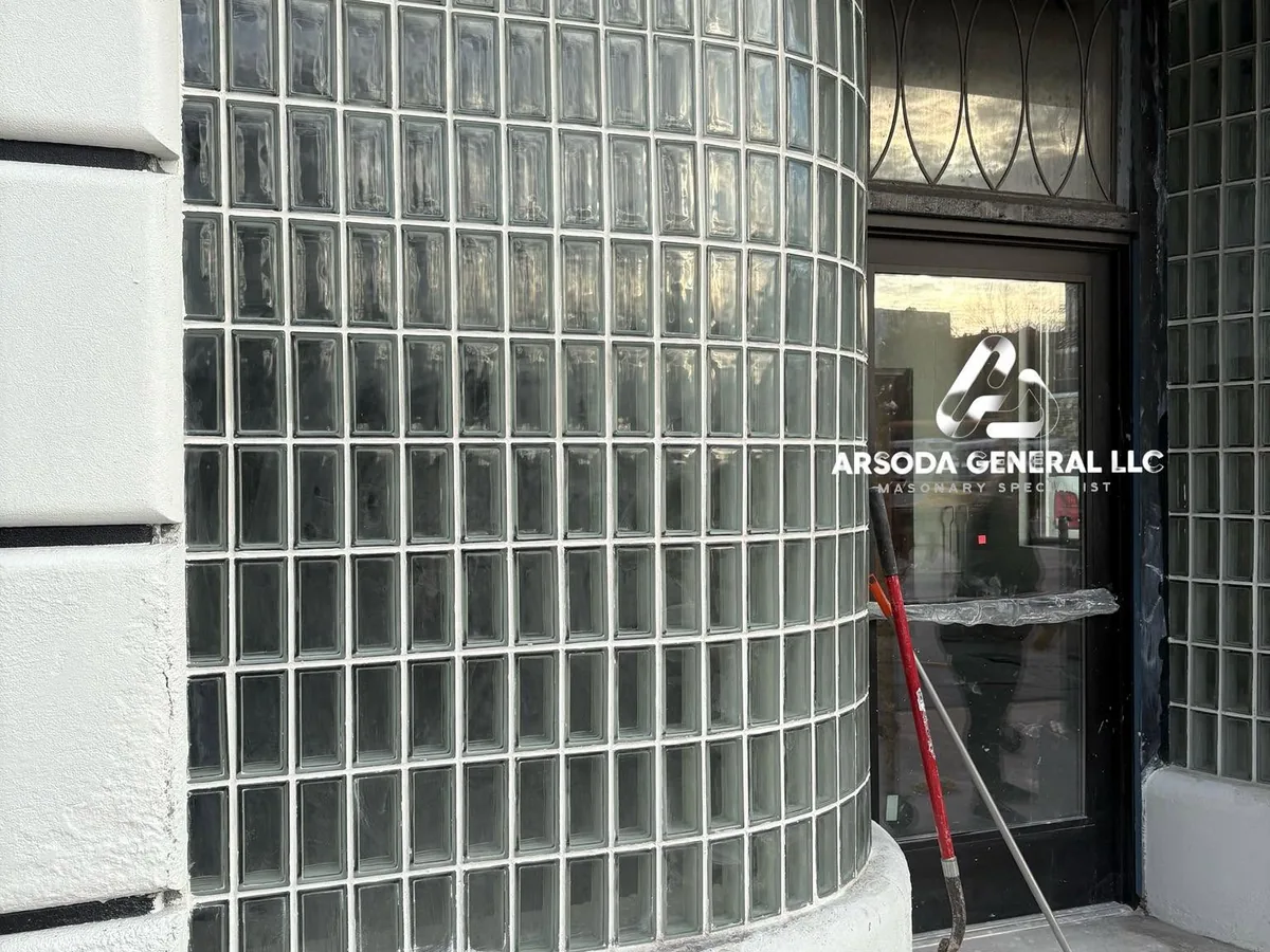 Curved glass block wall wrapping around a commercial entrance door